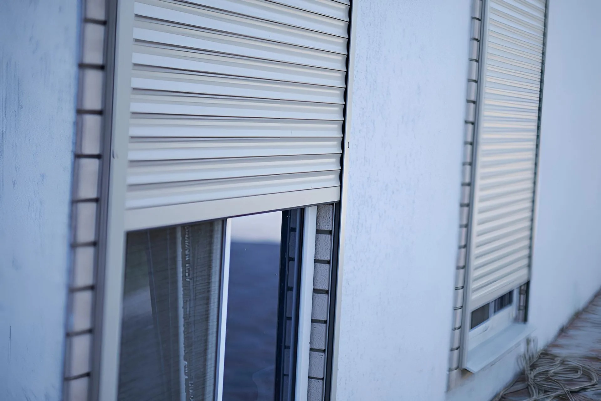 Security screens and roller shutters fitted to windows on a Shoalhaven home
