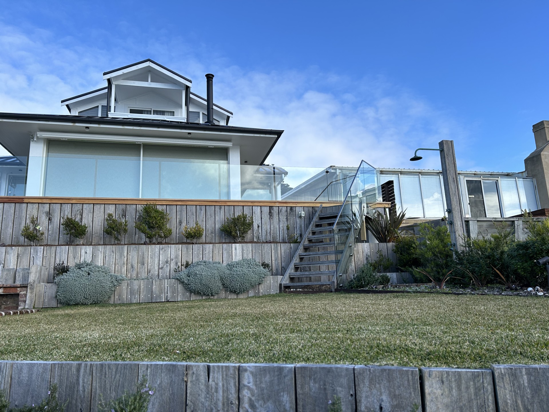 Frameless glass balustrade and stair panels installed on a Shoalhaven home by All Hours Glass