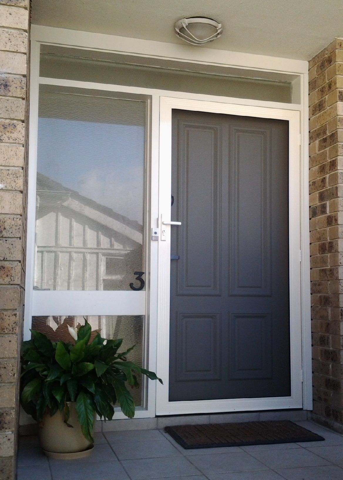 Stainless steel mesh security door fitted to a Shoalhaven home by All Hours Glass